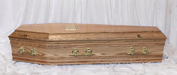 Oak finish coffin, natural colour with brass coloured handles