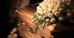 Photo of a coffin. Links to the page which lists our available coffins.